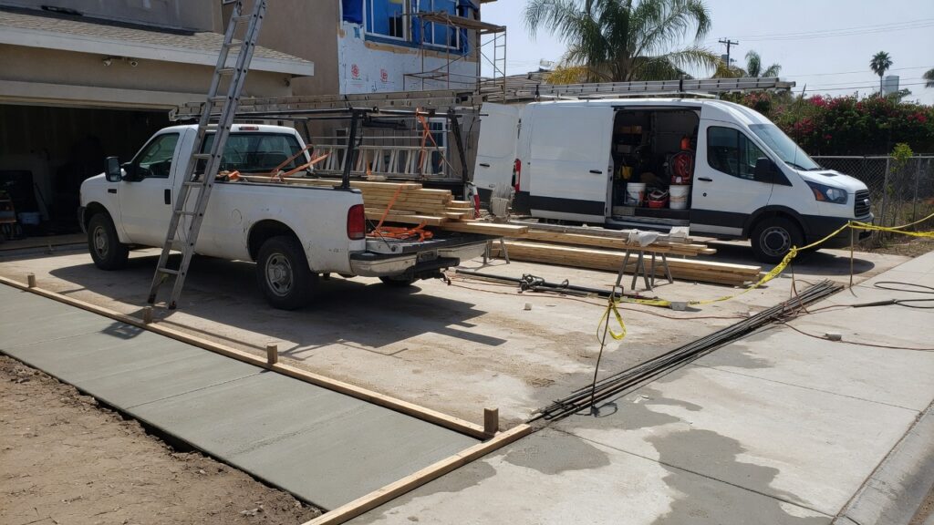 Contractor pickup and work van at a jobsite