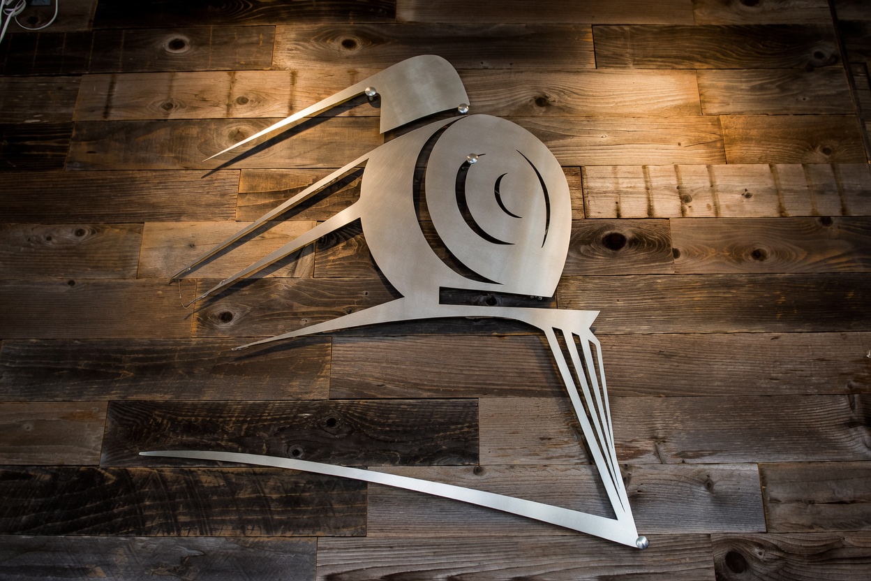 Mainline metal logo on the wood wall at 779 3rd Avenue